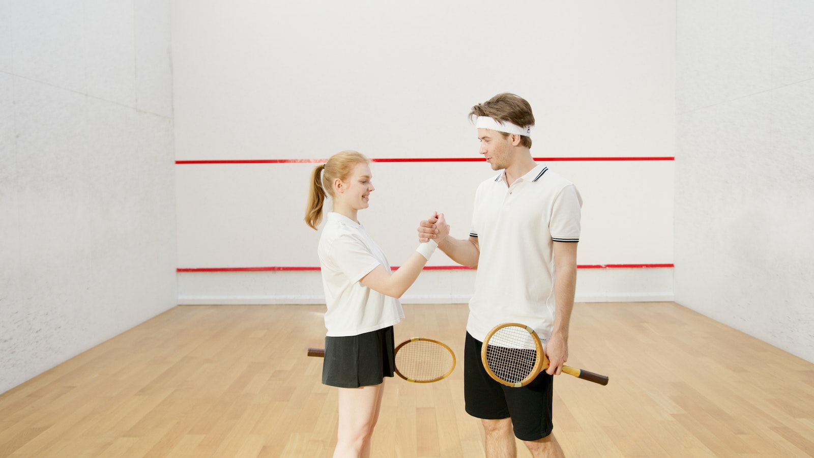 Squash Players Holding Hands on the Court
